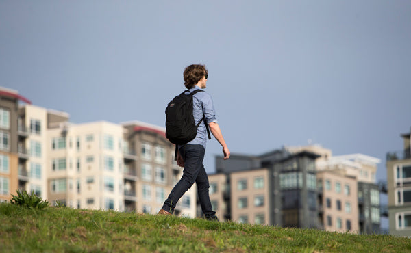 A person walking on a sidewalk with the Synapse 25.
